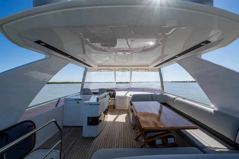Slide: The Image of Luxurious 2016 Princess Flybridge 64 Motor Yacht interior with elegant seating and dining area. - 29