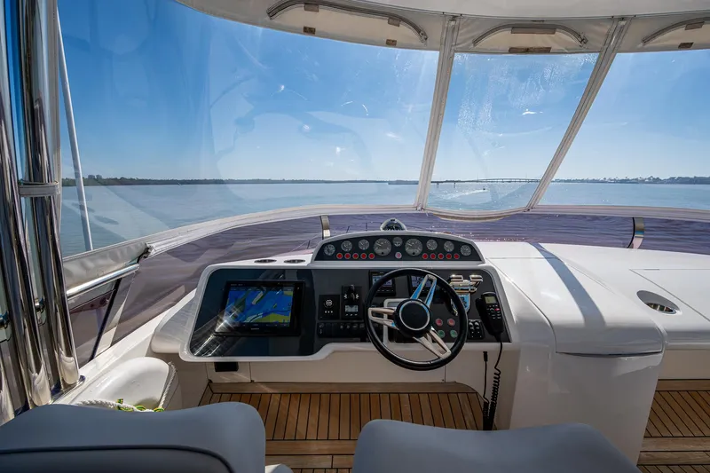 Slide: The Image of Helm of 2016 Princess Flybridge 64 Motor Yacht with panoramic sea view. - 33