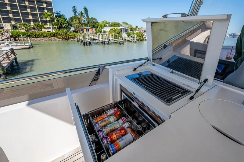 Slide: The Image of Outdoor kitchenette on 2016 Princess Flybridge 64 Motor Yacht with drinks and grill. - 38
