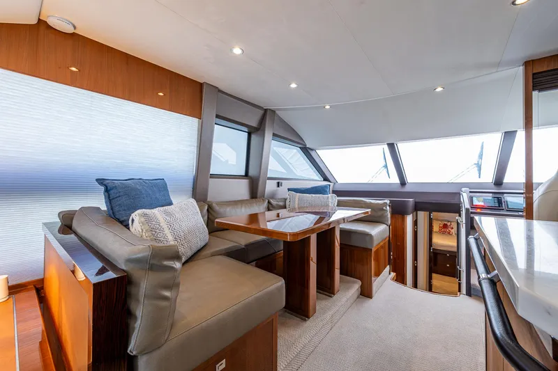 Slide: The Image of Luxurious interior of 2016 Princess Flybridge 64 Motor Yacht with elegant seating and dining area. - 44