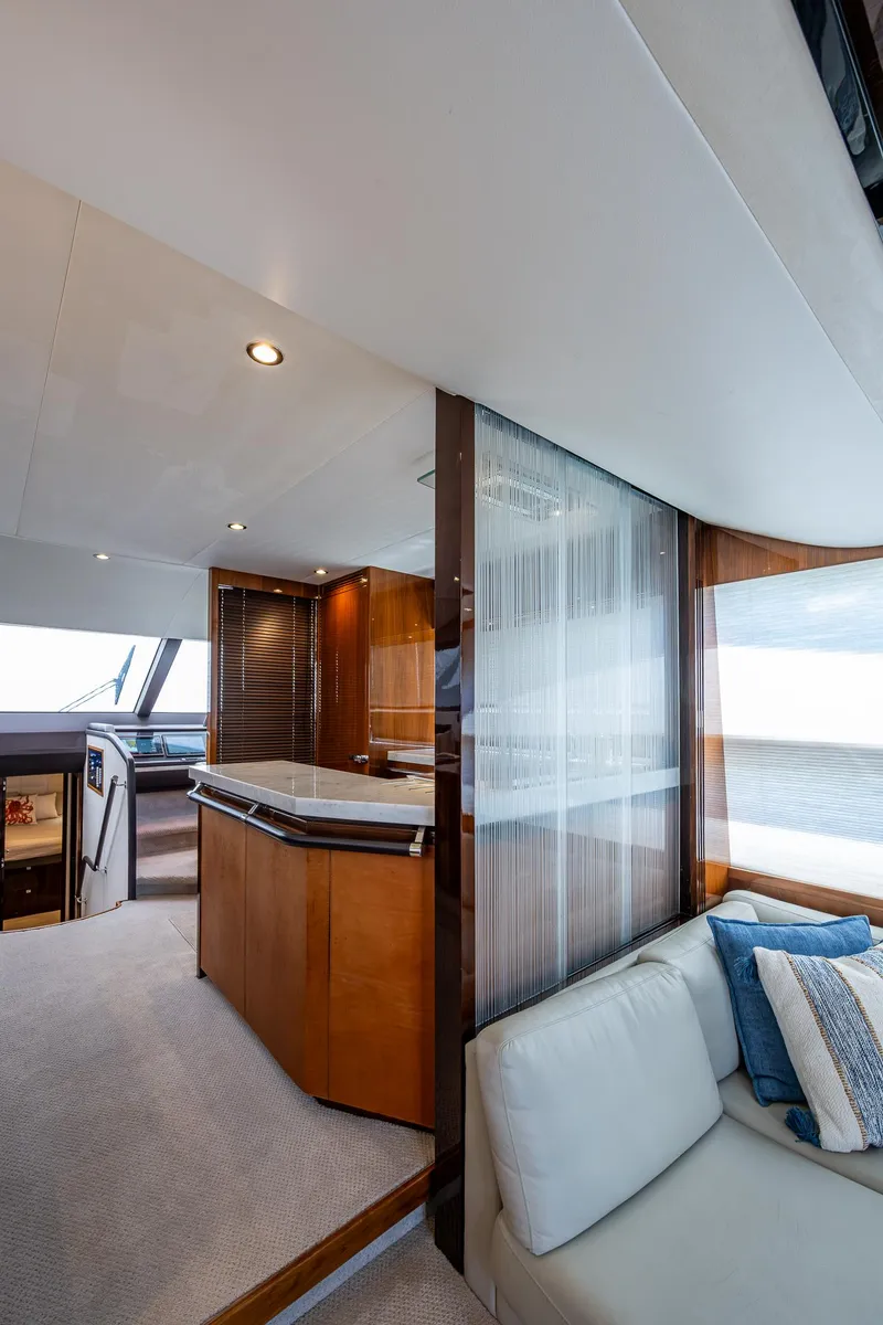 Slide: The Image of Luxurious interior of 2016 Princess Flybridge 64 Motor Yacht with modern design and cozy seating. - 48