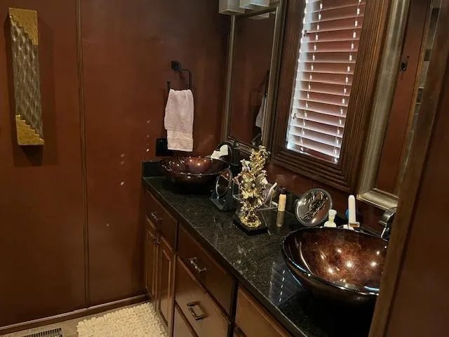 Slide: The Image of Luxurious 2013 Thoroughbred houseboat bathroom with dual vessel sinks and elegant decor. - 23