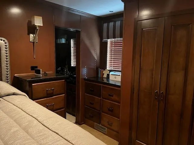 Slide: The Image of Luxurious 2013 Thoroughbred houseboat bedroom with wooden cabinetry and elegant decor. - 25