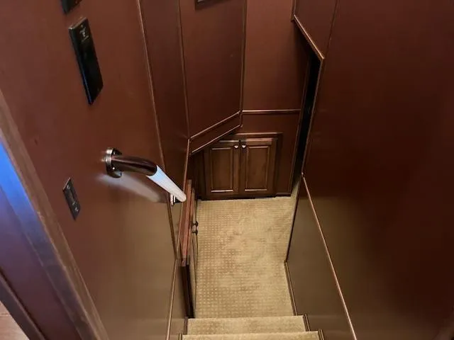 Slide: The Image of Staircase inside 2013 Thoroughbred houseboat with wooden walls and carpeted steps. - 29