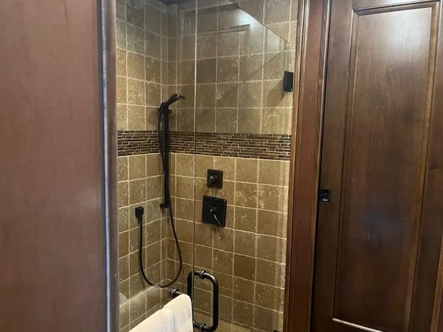 Slide: The Image of Shower area in 2013 Thoroughbred houseboat with tiled walls and modern fixtures. - 38