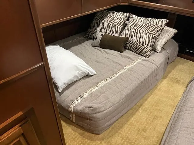 Slide: The Image of Cozy bedroom in 2013 Thoroughbred houseboat with plush bedding and decorative pillows. - 39