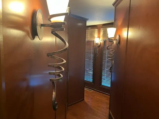 Slide: The Image of Luxurious 2013 Thoroughbred houseboat interior with elegant wooden paneling and spiral wall sconces. - 41