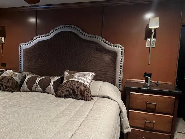 Slide: The Image of Luxurious bedroom interior on 2013 Thoroughbred houseboat with elegant headboard and plush bedding. - 44