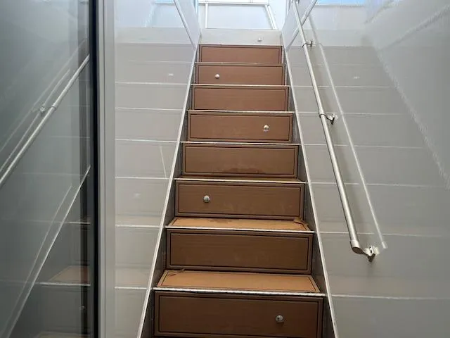 Slide: The Image of Staircase with storage drawers on a 2013 Thoroughbred houseboat. - 49