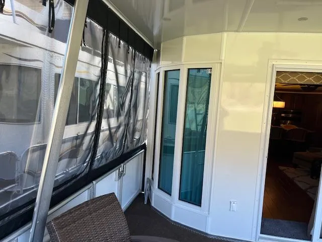 Slide: The Image of 2013 Thoroughbred houseboat interior with enclosed deck and sliding glass doors. - 5