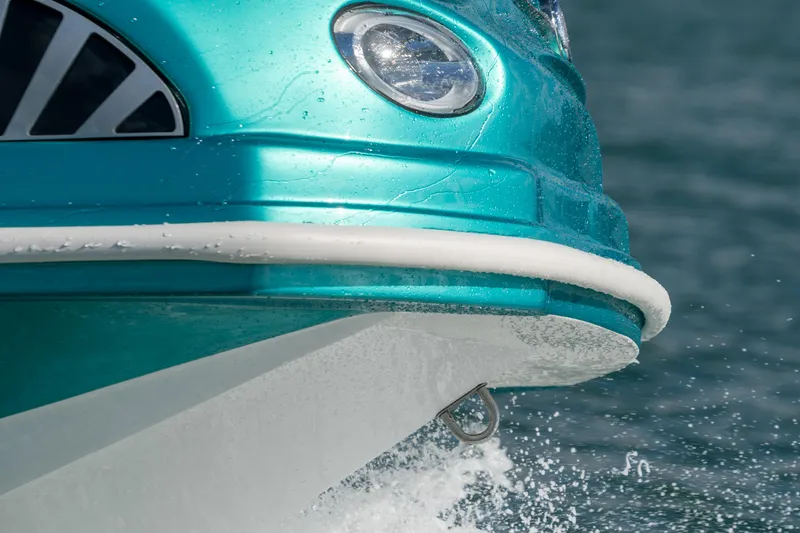 Slide: The Image of Turquoise boat with Fiat 500 Classic design, 2025 model, cruising on water. - 6