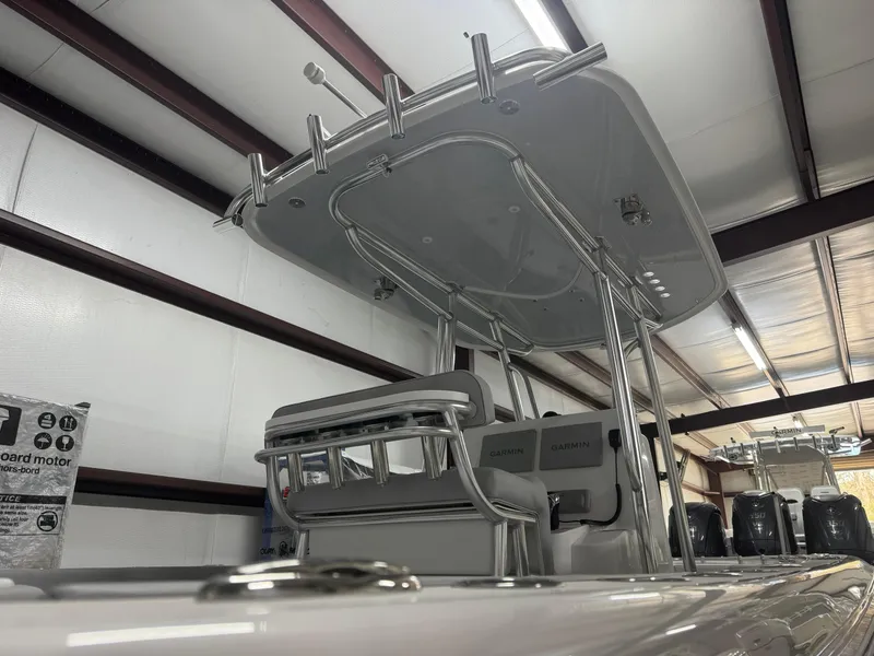 Slide: The Image of 2025 Contender 25 Tournament boat with T-top in a storage facility. - 19