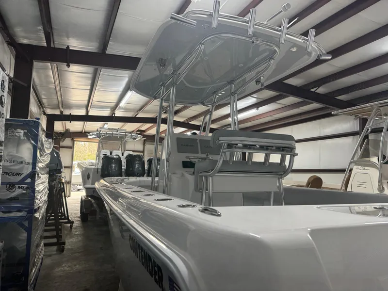 Slide: The Image of 2025 Contender 25 Tournament boat in storage, showcasing sleek design and modern features. - 3