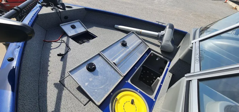 Slide: The Image of 2016 Tracker Pro Guide V-16 WT boat interior with open storage compartments. - 11