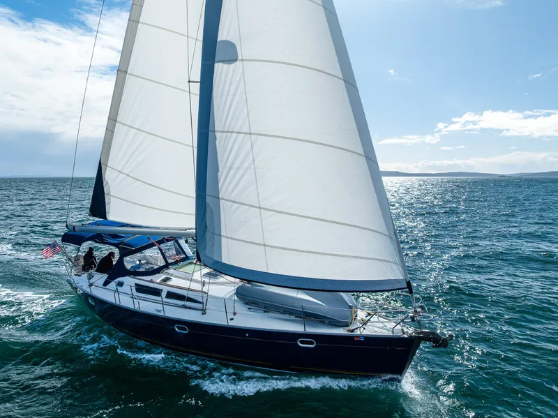Slide: The Image of Jeanneau Sun Odyssey 40 sailing on open sea, 2001 model, under clear blue sky. - 13