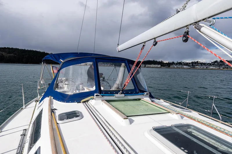 Slide: The Image of Jeanneau Sun Odyssey 40 sailboat, 2001 model, on calm waters under cloudy skies. - 19