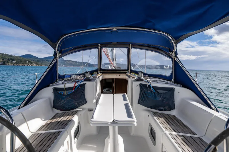 Slide: The Image of Cockpit view of 2001 Jeanneau Sun Odyssey 40 sailboat with blue canopy on open water. - 22