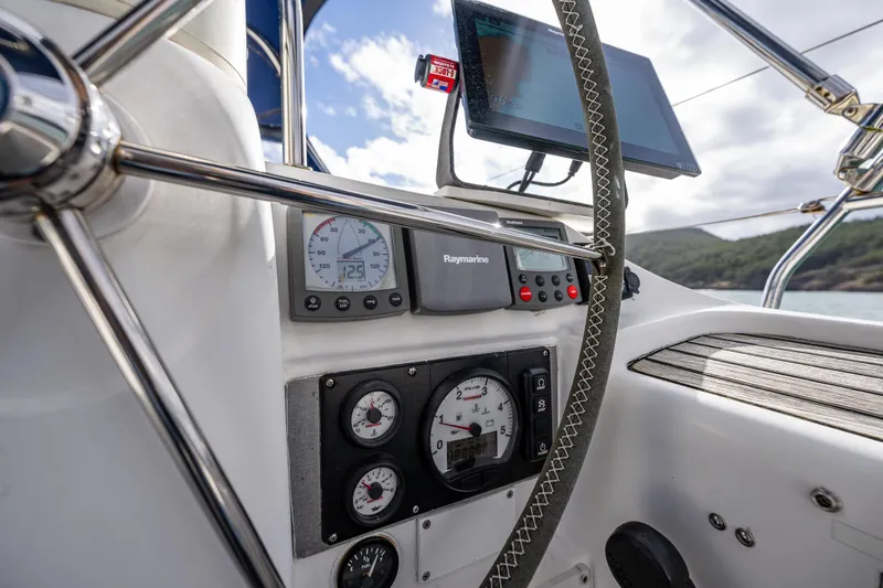 Slide: The Image of Cockpit instruments of 2001 Jeanneau Sun Odyssey 40 sailboat with navigation equipment. - 25