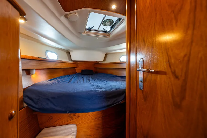 Slide: The Image of Cozy cabin interior of 2001 Jeanneau Sun Odyssey 40 sailboat with wooden finish. - 28