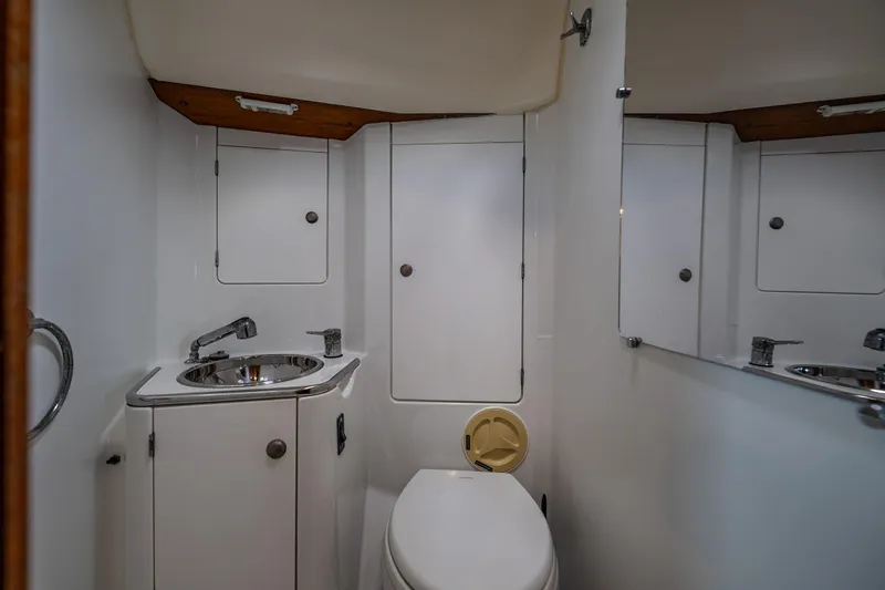 Slide: The Image of Bathroom interior of 2001 Jeanneau Sun Odyssey 40 yacht, featuring sink and toilet. - 29
