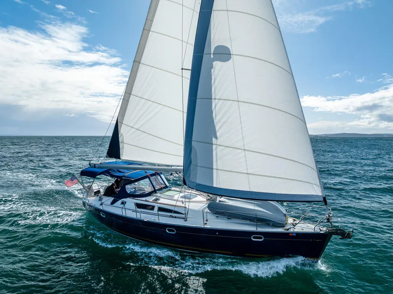 Slide: The Image of Jeanneau Sun Odyssey 40 sailing on open sea under clear blue sky. - 3