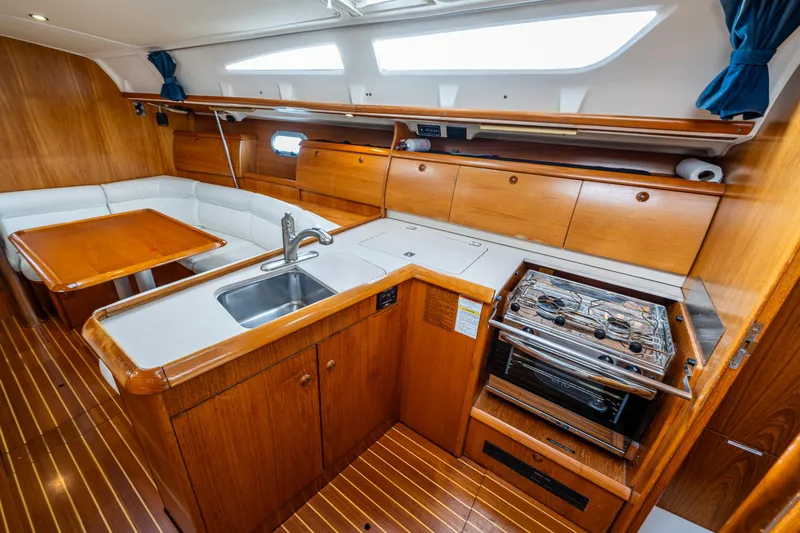 Slide: The Image of Interior of 2001 Jeanneau Sun Odyssey 40 yacht with kitchen and dining area. - 34