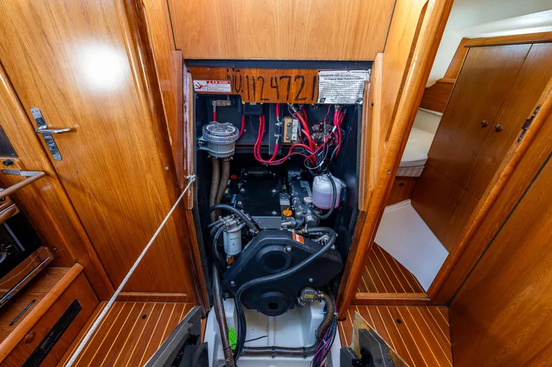 Slide: The Image of Engine compartment of 2001 Jeanneau Sun Odyssey 40 sailboat, showcasing detailed mechanical components. - 41