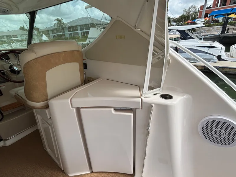 Slide: The Image of 2008 Tiara Yachts 3900 Sovran interior with helm seat and storage compartment. - 12