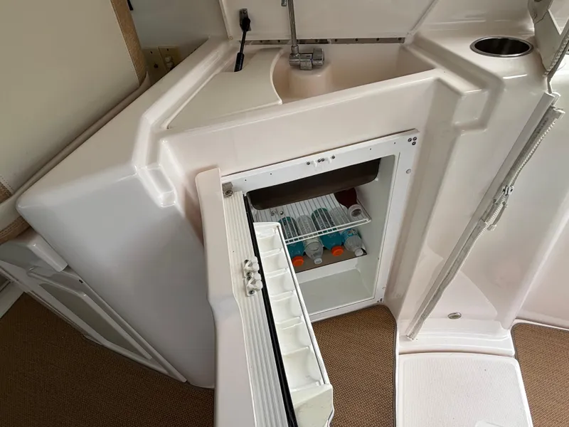 Slide: The Image of 2008 Tiara Yachts 3900 Sovran interior with open mini fridge and sink. - 14