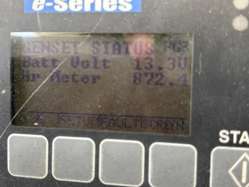 Slide: The Image of Display screen showing genset status with battery voltage and hour meter readings. - 18