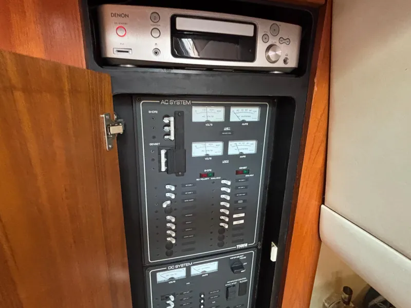 Slide: The Image of 2008 Tiara Yachts 3900 Sovran electrical panel with Denon audio system. - 20