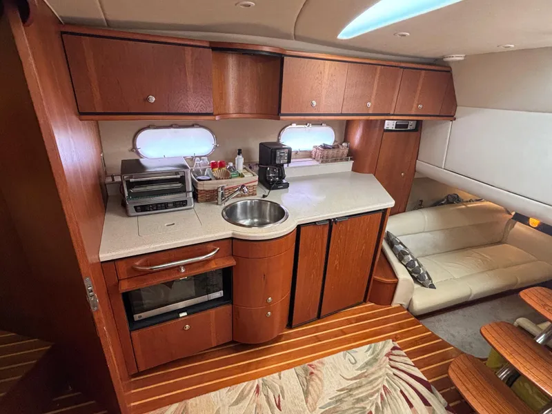 Slide: The Image of Luxurious 2008 Tiara Yachts 3900 Sovran interior with kitchenette and seating area. - 25