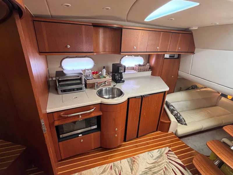 Slide: The Image of 2008 Tiara Yachts 3900 Sovran interior with kitchen and seating area. - 26