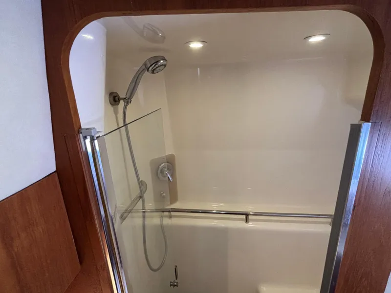 Slide: The Image of 2008 Tiara Yachts 3900 Sovran shower with glass door and modern fixtures. - 33