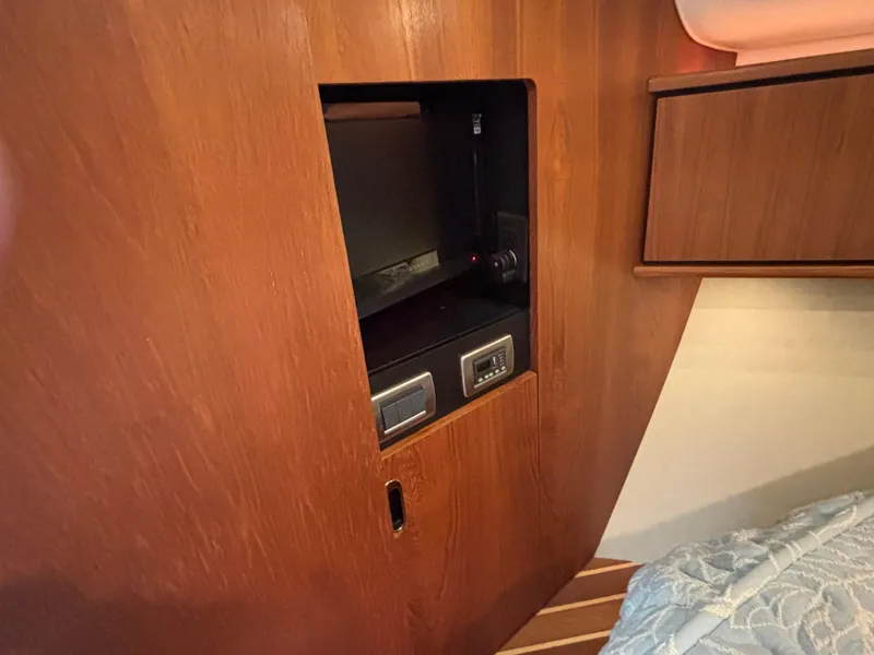 Slide: The Image of 2008 Tiara Yachts 3900 Sovran interior with wooden cabinetry and built-in safe. - 41