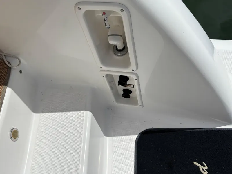 Slide: The Image of 2008 Tiara Yachts 3900 Sovran deck with utility access panel and controls. - 43