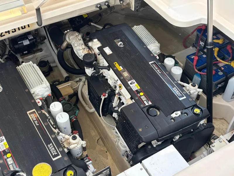 Slide: The Image of Engine compartment of a 2008 Tiara Yachts 3900 Sovran, showcasing dual engines and battery setup. - 47