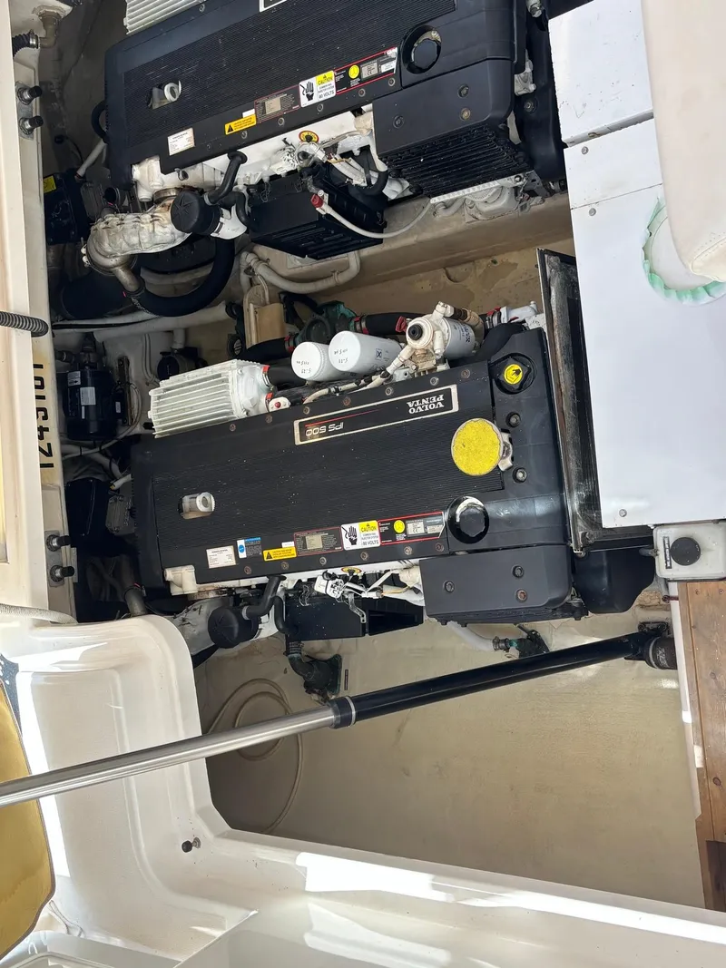 Slide: The Image of Engine compartment of a 2008 Tiara Yachts 3900 Sovran, showcasing dual engines. - 48