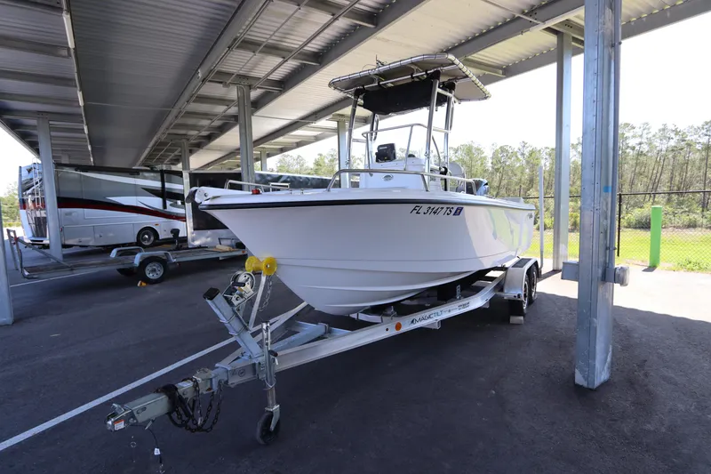 Slide: The Image of 2024 Edgewater 188CC boat on trailer in covered parking area. - 4
