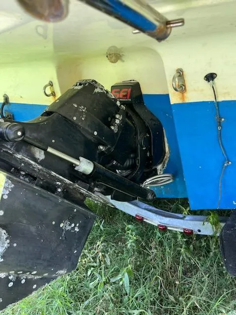 Slide: The Image of 2006 Bayliner 265 Cruiser boat stern drive with visible wear and marine growth. - 10