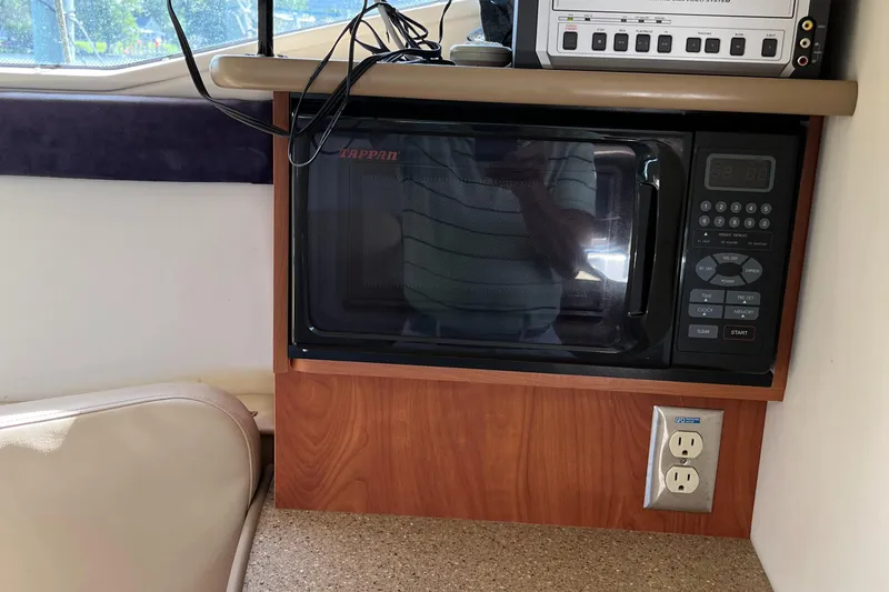 Slide: The Image of Microwave in 2006 Bayliner 265 Cruiser cabin with power outlet nearby. - 28