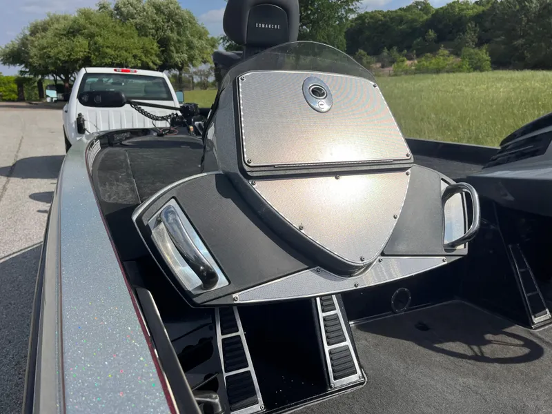 Slide: The Image of 2013 Ranger Z520C boat interior with steering wheel and control panel in grassy field. - 20