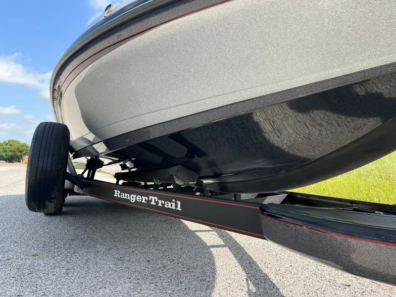 Slide: The Image of 2013 Ranger Z520C boat on trailer, featuring Lowrance equipment, parked on a sunny day. - 25