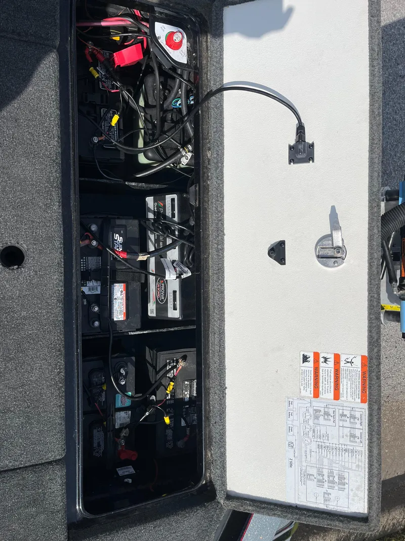 Slide: The Image of 2013 Ranger Z520C boat with Evinrude motor on trailer, parked on roadside. - 28