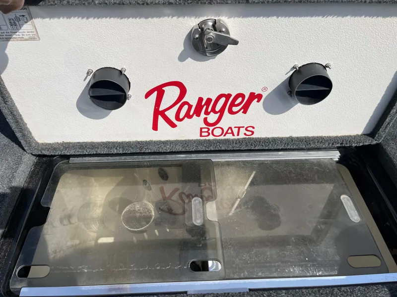 Slide: The Image of Storage compartment in a 2013 Ranger Z520C boat with NOCO accessory inside. - 30