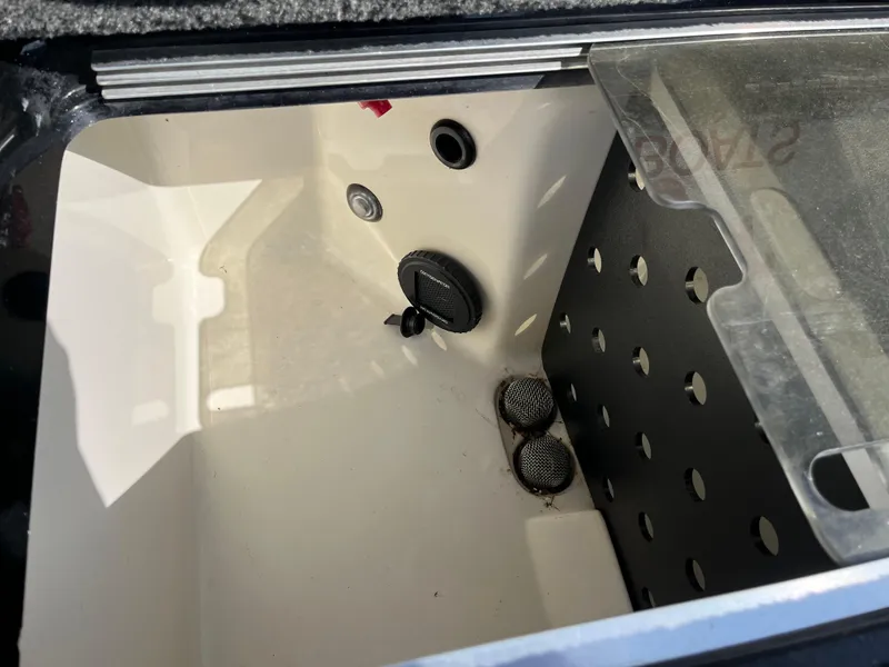 Slide: The Image of 2013 Ranger Z520C boat compartment with logo and secure latch. - 31