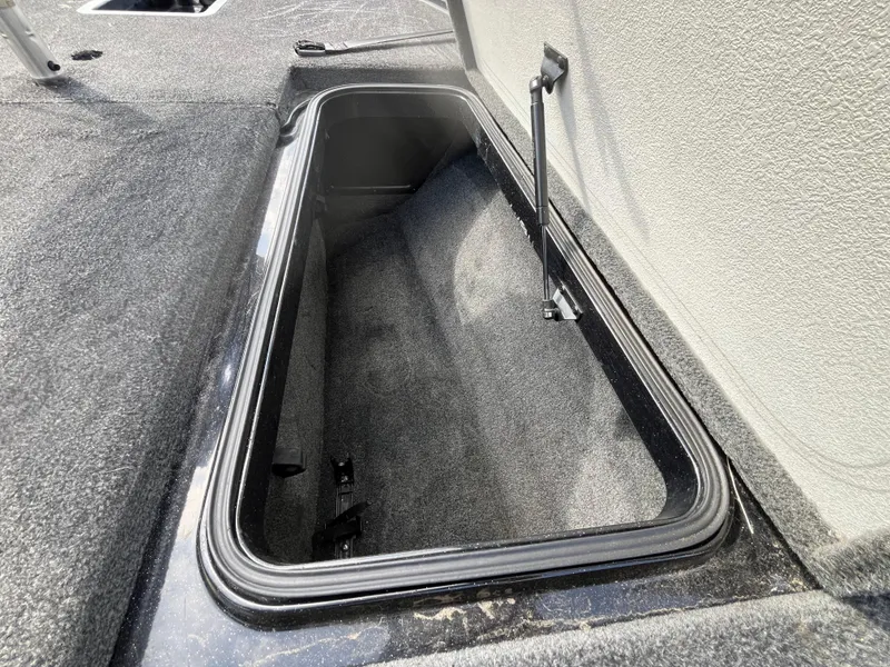 Slide: The Image of 2013 Ranger Z520C boat storage compartment open on deck. - 38