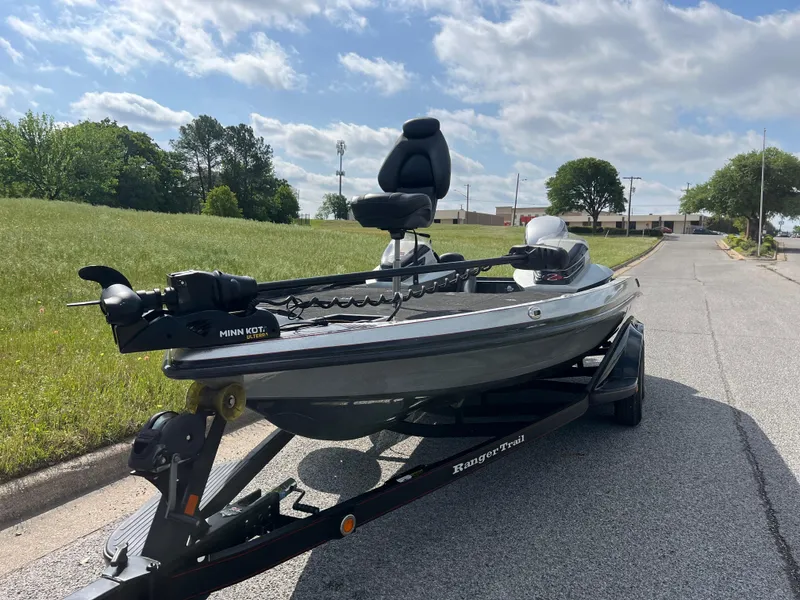Slide: The Image of 2013 Ranger Z520C boat with Evinrude 250 engine on a sunny street. - 4