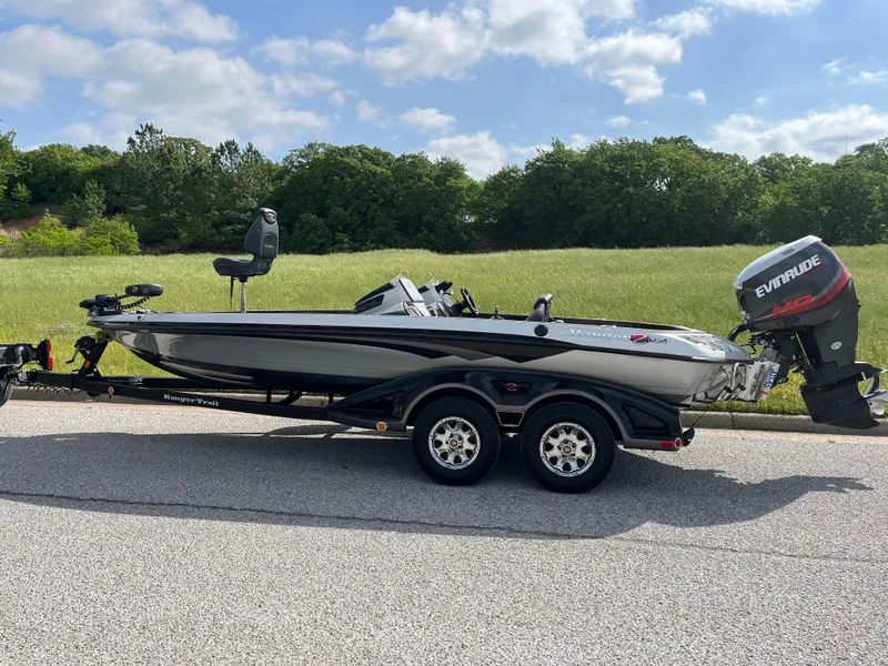 Slide: The Image of 2013 Ranger Z520C boat on trailer under cloudy sky. - 6