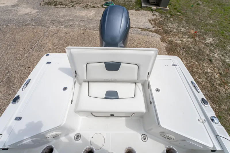 Slide: The Image of 2021 Wellcraft 221 Bay boat interior with seating and motor, viewed from above. - 15